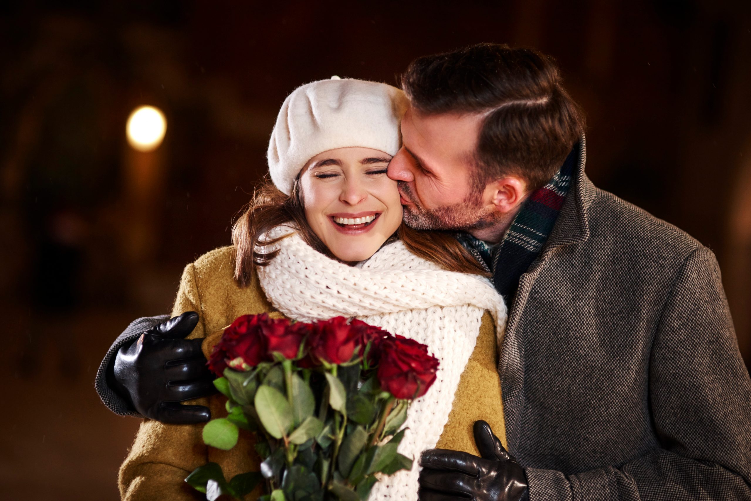 Laughing couple wearing high-quality, formal winter gloves. GLOVE DOVE® The Ultimate Glove Saver!™ can be used for your formal and winter gloves